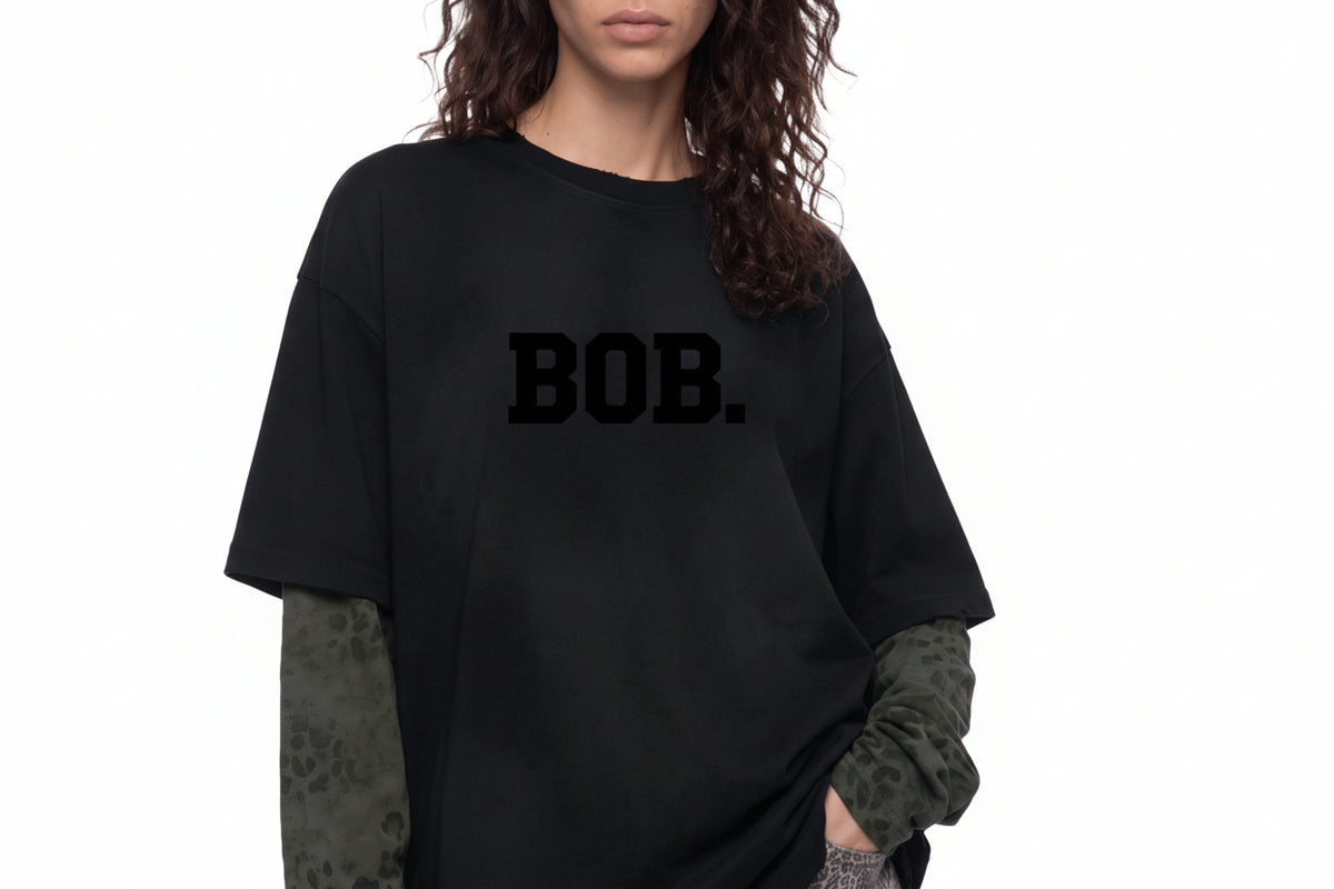 Model wearing the BOB leopard panel long-sleeve tee, close up