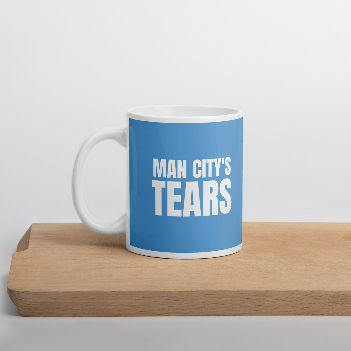 White MAN CITY'S TEARS mug, front view with handle on the right