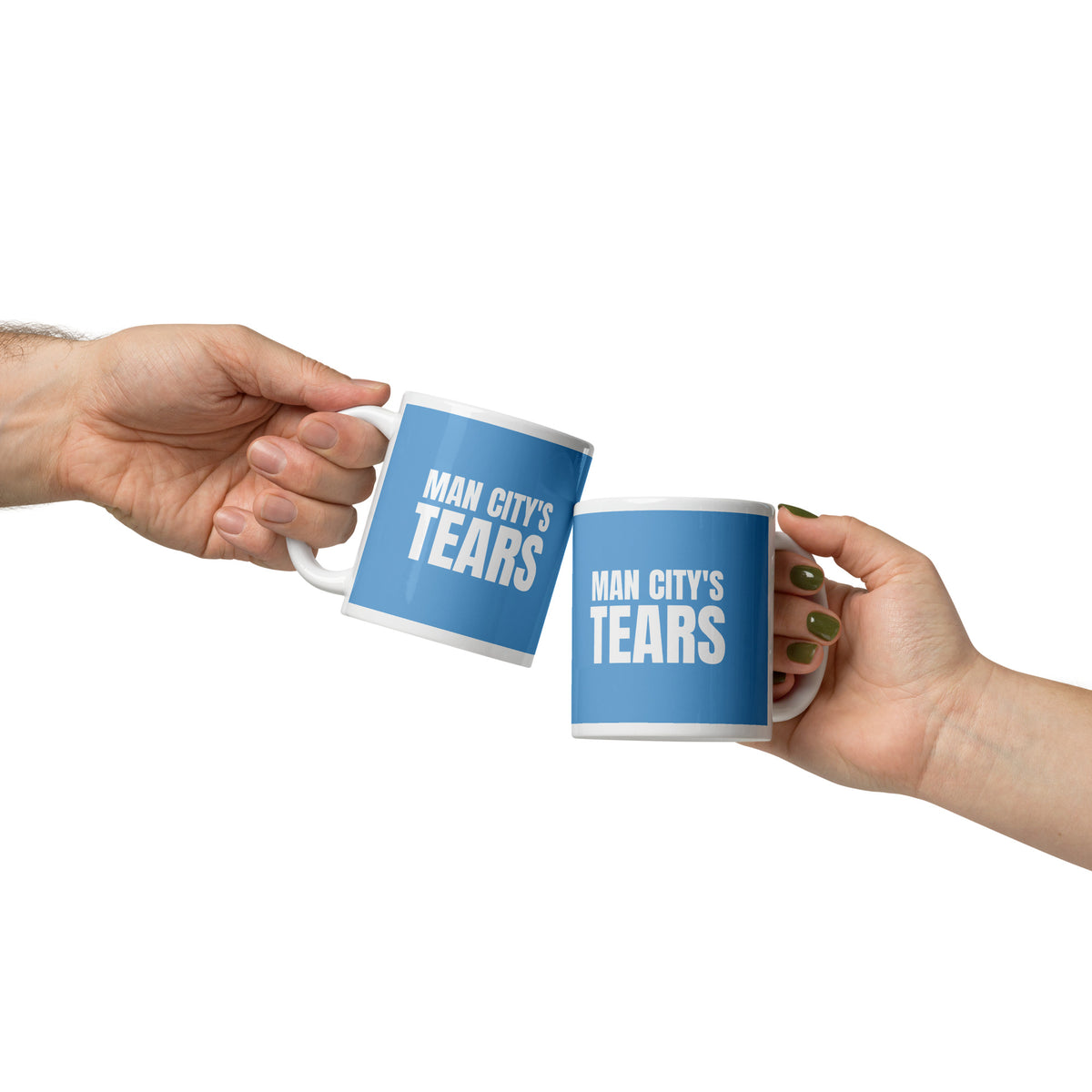 Hand holding a MAN CITY'S TEARS mug