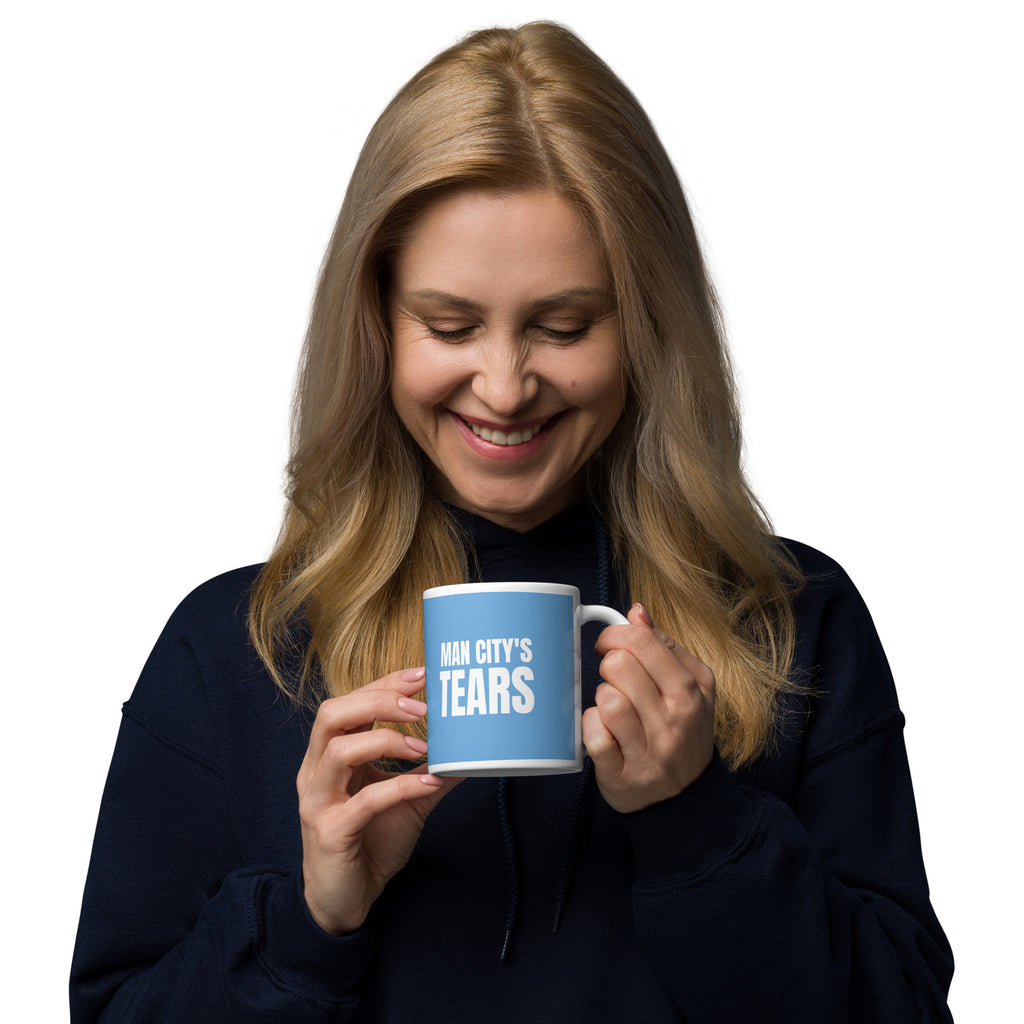 Man holding a MAN CITY'S TEARS mug